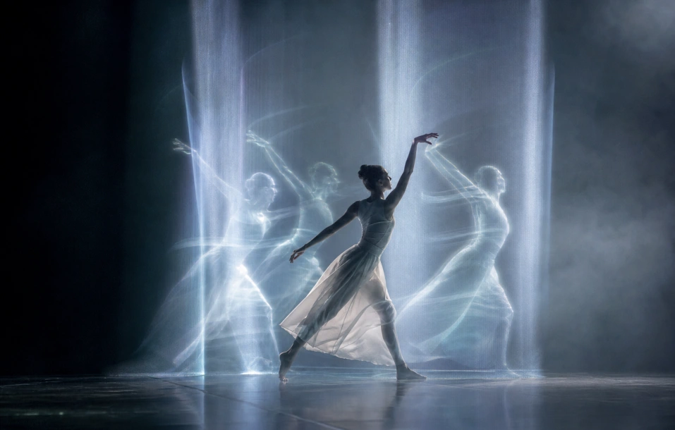 Dancer with holographic style light echoes on stage